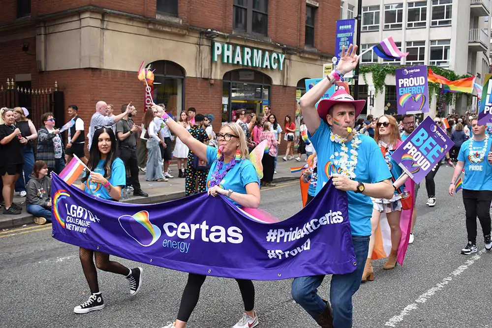 Certas Energy employees celebrating in parade at Manchester Pride 2025.